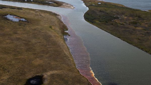 An aerial view shows the pollution in a river outside Norilsk on June 6, 2020.  - Sputnik International