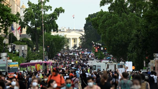 Demonstrators march on 16th St. near the White House, during a protest against racial inequality in the aftermath of the death in Minneapolis police custody of George Floyd, in Washington, U.S. June 6, 2020 Demonstrators march on 16th St. near the White House, during a protest against racial inequality in the aftermath of the death in Minneapolis police custody of George Floyd, in Washington, U.S. June 6, 2020 - Sputnik International