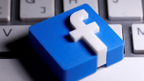 A 3D-printed Facebook logo is seen placed on a keyboard in this illustration taken March 25, 2020 A 3D-printed Facebook logo is seen placed on a keyboard in this illustration taken March 25, 2020 - Sputnik International