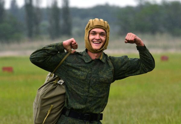 A recruit reacting to his first parachute jump at the Enem airfield of Russia's Volunteer Society for Cooperation with the Army, Aviation, and Navy (DOSAAF) in the Krasnodar Territory A recruit reacting to his first parachute jump at the Enem airfield of Russia's Volunteer Society for Cooperation with the Army, Aviation, and Navy (DOSAAF) in the Krasnodar Territory - Sputnik International