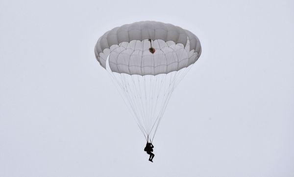A recruit descending by a parachute during his first jump at the Enem airfield in the Krasnodar Territory, Russia A recruit descending by a parachute during his first jump at the Enem airfield in the Krasnodar Territory, Russia - Sputnik International