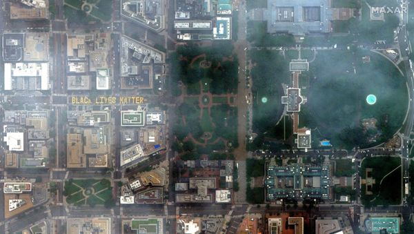 The new Black Lives Matter lettering painted on 16th Street NW and the White House (R) are seen in Washington, DC, U.S. The new Black Lives Matter lettering painted on 16th Street NW and the White House (R) are seen in Washington, DC, U.S. - Sputnik International