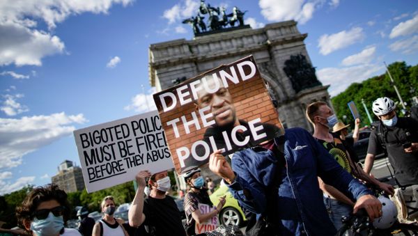 People hold up signs as they gather during a protest against racial inequality in the aftermath of the death in Minneapolis police custody of George Floyd, in front of the at Grand Army Plaza in the Brooklyn borough of New York City, New York, U.S. June 7, 2020. People hold up signs as they gather during a protest against racial inequality in the aftermath of the death in Minneapolis police custody of George Floyd, in front of the at Grand Army Plaza in the Brooklyn borough of New York City, New York, U.S. June 7, 2020. - Sputnik International