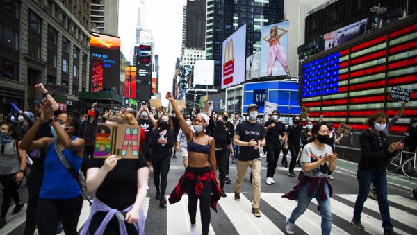 Protesters chant during a solidarity march for George Floyd down Times Square, Tuesday, June 2, 2020, in the Manhattan borough of New York - Sputnik International