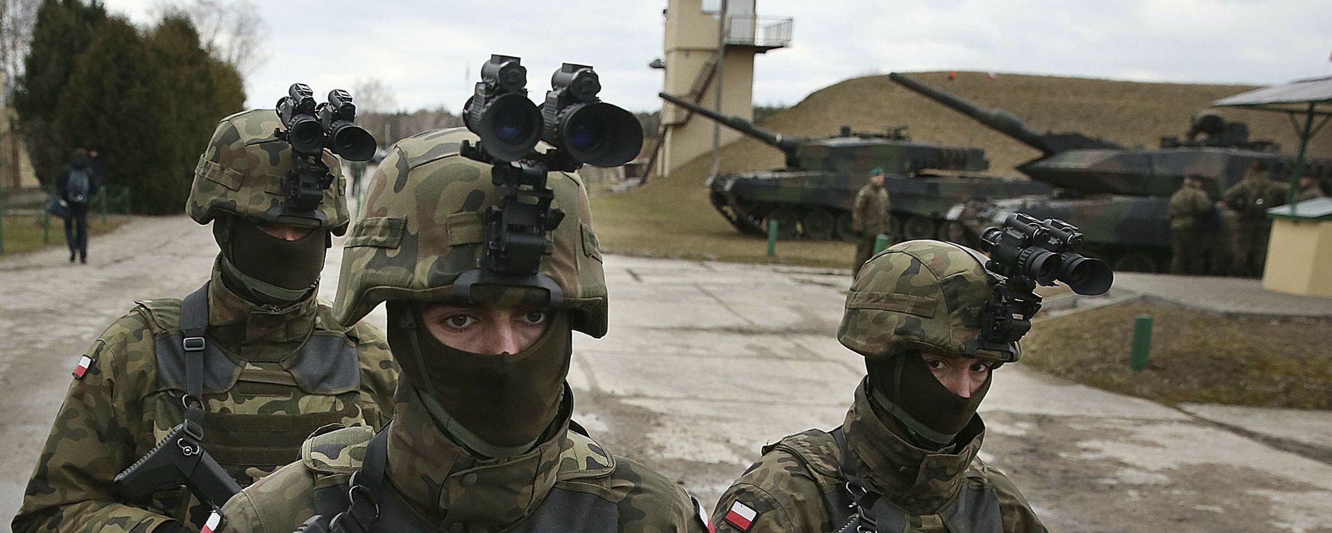 In this photo taken March 10, 2019, in Wesola,near Warsaw, central Poland, are seen Polish troops in combat gear during brief exercise with some other NATO forces marking 20 years since Poland, the Czech Republic and Hungary joined the Western military alliance - Sputnik International, 1920, 10.02.2022