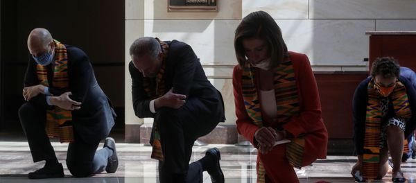 U.S. House Speaker Nancy Pelosi (D-CA) and Senate Minority Leader Chuck Schumer (D-NY) kneel with Congressional Democrats during a moment of silence to honor George Floyd, Breonna Taylor, Ahmaud Arbery and others inside Emancipation Hall after weeks of protests against racial inequality in the aftermath in Minneapolis police custody of Floyd, at the U.S. Capitol in Washington, U.S., June 8, 2020 U.S. House Speaker Nancy Pelosi (D-CA) and Senate Minority Leader Chuck Schumer (D-NY) kneel with Congressional Democrats during a moment of silence to honor George Floyd, Breonna Taylor, Ahmaud Arbery and others inside Emancipation Hall after weeks of protests against racial inequality in the aftermath in Minneapolis police custody of Floyd, at the U.S. Capitol in Washington, U.S., June 8, 2020 - Sputnik International