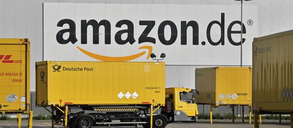 FILE - In this file photo dated Wednesday, Nov. 14, 2018, post trucks leave the Amazon Logistic Center in Rheinberg, Germany FILE - In this file photo dated Wednesday, Nov. 14, 2018, post trucks leave the Amazon Logistic Center in Rheinberg, Germany - Sputnik International