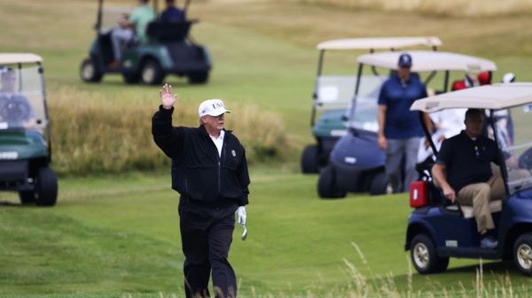 FILE - In this July 14, 2018 file photo, President Donald Trump waves to protesters while playing golf at Turnberry golf club, in Turnberry, Scotland - Sputnik International