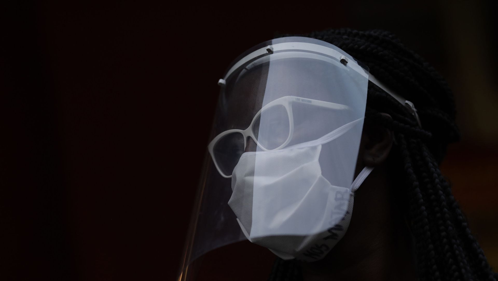 A woman wearing a face mask and shield to protect herself from the spread of the new coronavirus, takes part in a protest against racism and police violence during a Black Lives Matter demonstration amid in Duque de Caxias, Brazil, Wednesday, June 10, 2020. A woman wearing a face mask and shield to protect herself from the spread of the new coronavirus, takes part in a protest against racism and police violence during a Black Lives Matter demonstration amid in Duque de Caxias, Brazil, Wednesday, June 10, 2020. - Sputnik International, 1920, 04.05.2021