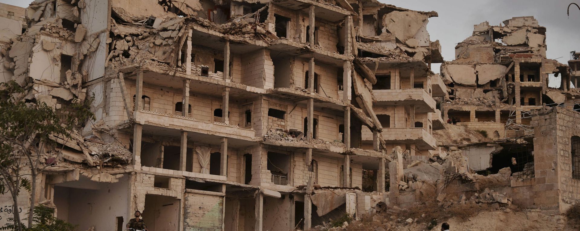 Buildings destroyed during the fighting in the northern town of Ariha, in Idlib province Buildings destroyed during the fighting in the northern town of Ariha, in Idlib province - Sputnik International, 1920, 04.03.2021