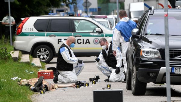 Forensic police officers wearing face masks work next to the body of an attacker as they inspect the scene of an assault on staff at a school in Vrutky, Slovakia, June 11, 2020 Forensic police officers wearing face masks work next to the body of an attacker as they inspect the scene of an assault on staff at a school in Vrutky, Slovakia, June 11, 2020 - Sputnik International