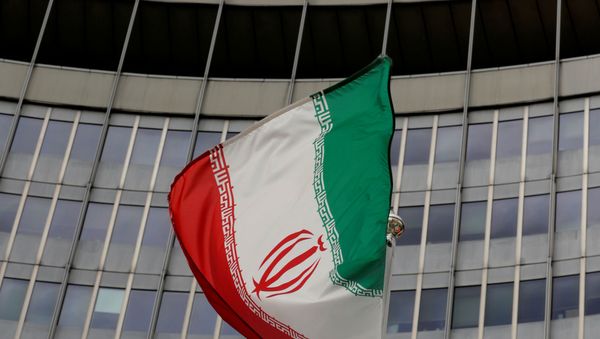 An Iranian flag flutters in front of the International Atomic Energy Agency (IAEA) headquarters in Vienna, Austria, September 9, 2019.   - Sputnik International