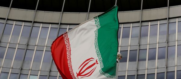 An Iranian flag flutters in front of the International Atomic Energy Agency (IAEA) headquarters in Vienna, Austria, September 9, 2019.   - Sputnik International