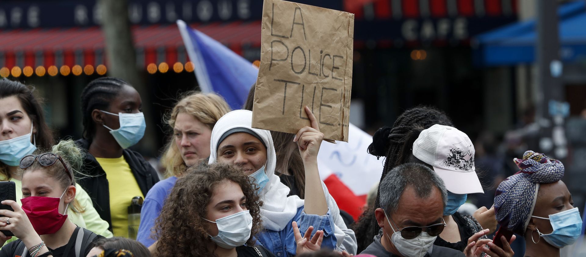 A placard read The Police Kills as people gather for a march against police brutality and racism in Paris, France A placard read The Police Kills as people gather for a march against police brutality and racism in Paris, France - Sputnik International, 1920, 13.06.2020