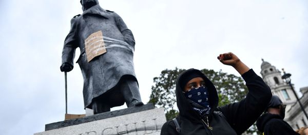 FILE PHOTO: A demonstrator reacts infront of graffiti on a statue of Winston Churchill in Parliament Square during a Black Lives Matter protest in London, following the death of George Floyd who died in police custody in Minneapolis, London, Britain, June 7, 2020.  - Sputnik International