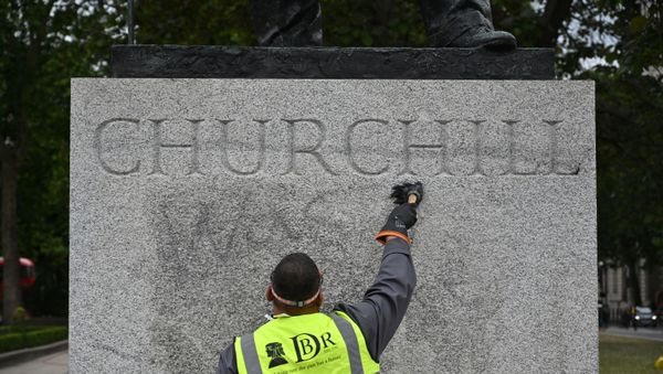 The statue of former British prime minister Winston Churchill is cleaned in Parliament Square, central London on June 8, 2020, after being defaced, with the words (Churchill) was a racist written on it's base by protesters at a demonstration on June 7, 2020, organised to show solidarity with the Black Lives Matter movement. The statue of former British prime minister Winston Churchill is cleaned in Parliament Square, central London on June 8, 2020, after being defaced, with the words (Churchill) was a racist written on it's base by protesters at a demonstration on June 7, 2020, organised to show solidarity with the Black Lives Matter movement. - Sputnik International