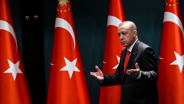 Turkish President Recep Tayyip Erdogan gestures and reacts as he arrives on stage to deliver a speech following a cabinet meeting, in Ankara, on June 9, 2020. - Sputnik International