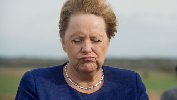 German Chancellor Angela Merkel is pictured standing in the wind after visiting the newly opened tourist information centre and inaugurating an electric bus, on the the island of Ummanz, near the island of Ruegen in north-eastern Germany, on October 25, 2019 - Sputnik International