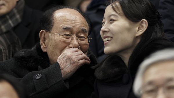Kim Yo Jong, sister of North Korean leader Kim Jong Un, right, and North Korea's nominal head of state Kim Yong Nam, talk as they for the start of the preliminary round of the women's hockey game between Switzerland and the combined Koreas at the 2018 Winter Olympics in Gangneung, South Korea, Saturday, Feb. 10, 2018.  - Sputnik International