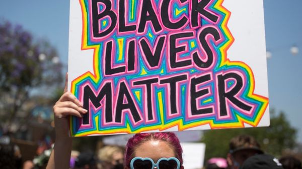 A participant holding a sign reading Black Lives Matter takes part in an All Black Lives Matter march, organized by Black LGBTQ+ leaders, in the aftermath of the death in Minneapolis police custody of George Floyd, in Hollywood, Los Angeles, California, U.S., June 14, 2020 - Sputnik International