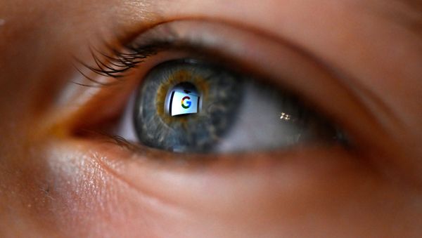 This illustration picture, taken on January 12, 2020 shows Google logo reflected on a eye in Rennes, western France - Sputnik International