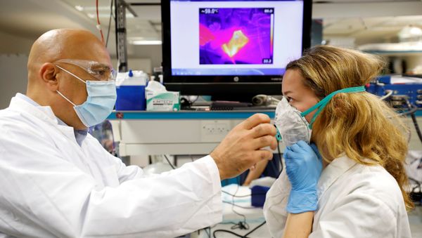 Israeli Professor Yair Ein-Eli, who led the research team which say they have invented a reusable face mask that can disinfect itself and kill the coronavirus disease (COVID-19), takes part in a demonstration for Reuters at a laboratory in Haifa, northern Israel June 10, 2020 Israeli Professor Yair Ein-Eli, who led the research team which say they have invented a reusable face mask that can disinfect itself and kill the coronavirus disease (COVID-19), takes part in a demonstration for Reuters at a laboratory in Haifa, northern Israel June 10, 2020 - Sputnik International