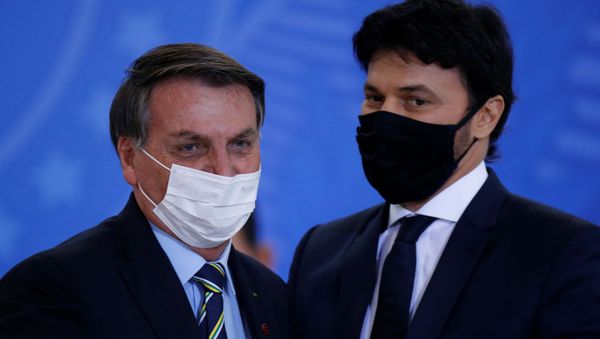 Brazil's President Jair Bolsonaro greets the new Communications Minister Fabio Faria during his inauguration ceremony at the Planalto Palace, in Brasilia, Brazil June 17, 2020 - Sputnik International