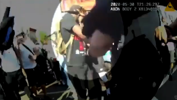 The NYPD released police body-camera footage of an incident where a police officer pulled down a protester’s face mask and pepper sprayed him. The NYPD released police body-camera footage of an incident where a police officer pulled down a protester’s face mask and pepper sprayed him. - Sputnik International
