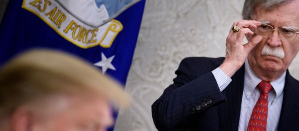  In this file photo taken on May 13, 2019, National Security Advisor John Bolton listens while US President Donald Trump speaks to the press before a meeting with Hungary's Prime Minister Viktor Orban in the Oval Office of the White House in Washington, DC. - Trump has no guiding principles and is unfit to be president, Bolton said in an interview released on June 18, 2020, to promote his explosive book. I don't think he's fit for office. I don't think he has the competence to carry out the job, Bolton told ABC News.  - Sputnik International