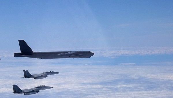 A B-52H Stratofortress deployed from Barksdale Air Force Base, La., flies alongside two Japan Air Self-Defense Force F-15s over the Sea of Japan while conducting a Bomber Task Force mission June 16, 2020. Bomber Task Force missions help maintain global stability and security while enabling units to become familiar with operations in different regions - Sputnik International