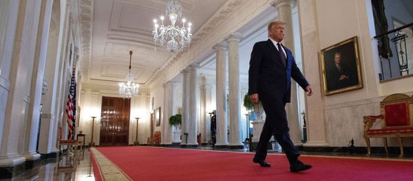 U.S. President Donald Trump walks down Cross Hall ahead of an event held to discuss an administration plan aimed at helping to prevent suicides by U.S. veterans and other Americans, at the White House in Washington, U.S., June 17, 2020. U.S. President Donald Trump walks down Cross Hall ahead of an event held to discuss an administration plan aimed at helping to prevent suicides by U.S. veterans and other Americans, at the White House in Washington, U.S., June 17, 2020. - Sputnik International