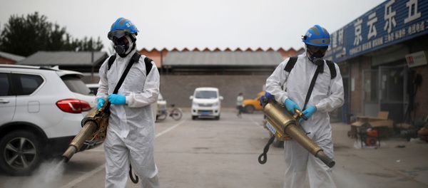 Volunteers from the Blue Sky Rescue team, in protective suits, disinfect the Nangong comprehensive market following a new outbreak of the coronavirus disease (COVID-19) in Beijing, China, June 18, 2020. Picture taken June 18, 2020. REUTERS/Carlos Garica Rawlins Volunteers from the Blue Sky Rescue team, in protective suits, disinfect the Nangong comprehensive market following a new outbreak of the coronavirus disease (COVID-19) in Beijing, China, June 18, 2020. Picture taken June 18, 2020. REUTERS/Carlos Garica Rawlins - Sputnik International