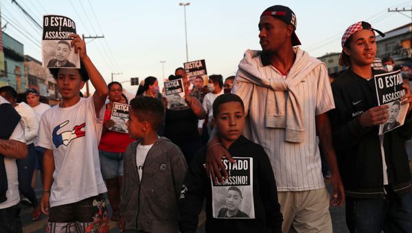 People take part in a protest against the death of teenager Guilherme Silva Guedes, 15, who disappeared in Vila Clara, in Sao Paulo, Brazil June 16, 2020. The placards show a picture of Guilherme Silva Guedes and read Justice for Guilherme! REUTERS/Amanda Perobelli - Sputnik International