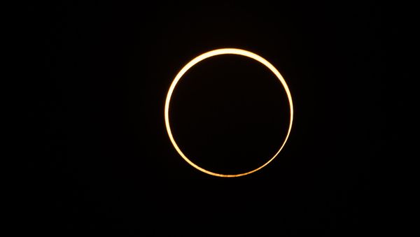 The moon moves in front of the sun in a rare ring of fire solar eclipse as seen from Singapore on December 26, 2019. - Sputnik International