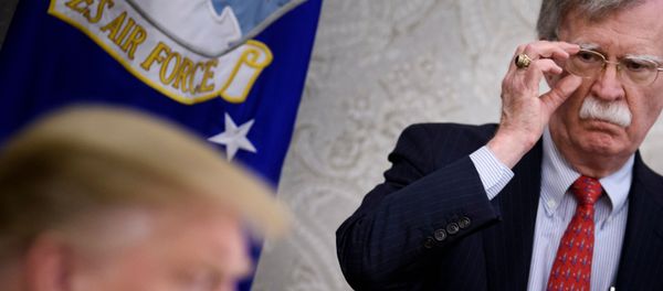 In this file photo taken on May 13, 2019, National Security Advisor John Bolton listens while US President Donald Trump speaks to the press before a meeting with Hungary's Prime Minister Viktor Orban in the Oval Office of the White House in Washington, DC. In this file photo taken on May 13, 2019, National Security Advisor John Bolton listens while US President Donald Trump speaks to the press before a meeting with Hungary's Prime Minister Viktor Orban in the Oval Office of the White House in Washington, DC. - Sputnik International
