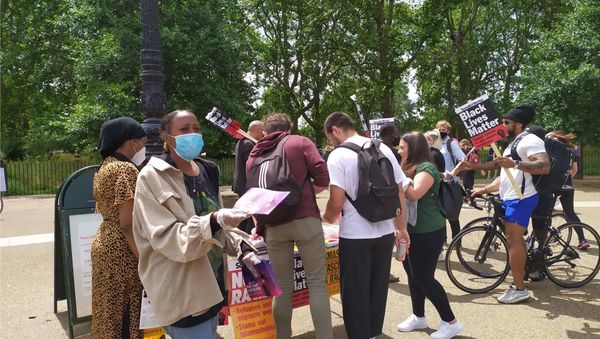 Members of the Socialist Worker handing out leaflets as part of the protest organised by groups operating under the BLM theme Members of the Socialist Worker handing out leaflets as part of the protest organised by groups operating under the BLM theme - Sputnik International