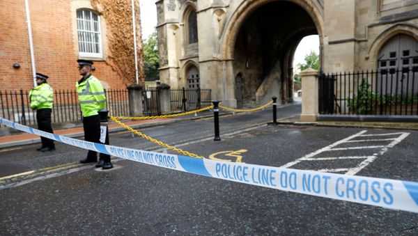 Police officers stand behind the cordon at the scene of multiple stabbings in Reading, Britain, 21 June 2020. - Sputnik International