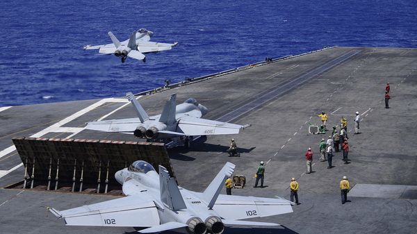  An E/A-18G Growler, assigned to the “Gray Wolves” of Electronic Attack Squadron (VAQ) 142, launches from the flight deck of the aircraft carrier USS Theodore Roosevelt (CVN 71) June 17, 2020. The Theodore Roosevelt Carrier Strike Group is on a scheduled deployment to the Indo-Pacific.  - Sputnik International