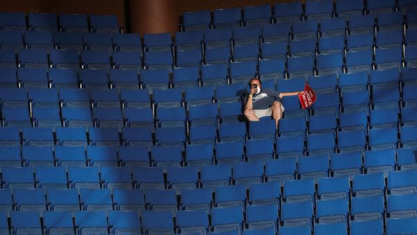 A supporter of U.S. President Donald Trump shoots a video with his mobile phone from the sparsely filled upper decks of the arena as the president addresses his first re-election campaign rally in several months in the midst of the coronavirus disease (COVID-19) outbreak, at the BOK Center in Tulsa, Oklahoma, U.S., June 20, 2020. REUTERS/Leah Millis     TPX IMAGES OF THE DAY - Sputnik International