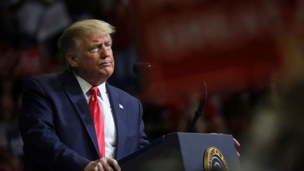 US President Donald Trump stands at the podium listening to his supporters cheer as he addresses his first re-election campaign rally in several months in the midst of the coronavirus disease (COVID-19) outbreak, at the BOK Center in Tulsa, Oklahoma, U.S., 20 June 2020. - Sputnik International