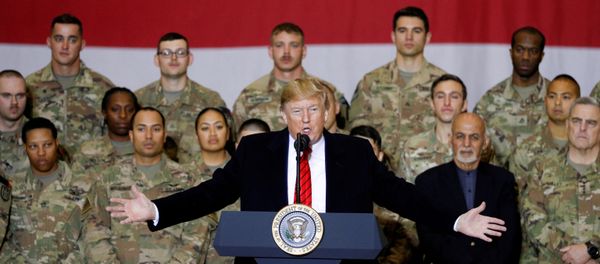 US President Donald Trump delivers remarks to US troops, with Afghanistan President Ashraf Ghani standing behind him, during an unannounced visit to Bagram Air Base, Afghanistan, 28 November 2019 - Sputnik International