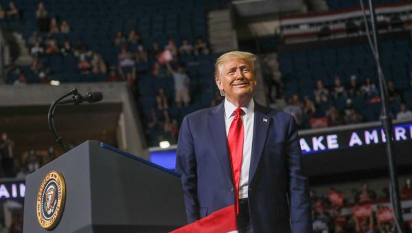 U.S. President Donald Trump smiles at the crowd as he arrives at the podium to speak during his first re-election campaign rally in several months in the midst of the coronavirus disease (COVID-19) outbreak, at the BOK Center in Tulsa, Oklahoma, U.S., June 20, 2020 - Sputnik International