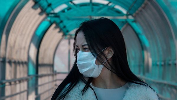 Asian woman wearing a mask - Sputnik International