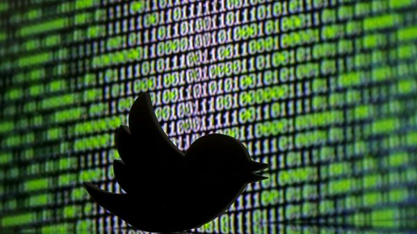 A 3D printed Twitter logo is seen in front of a displayed cyber code in this illustration taken March 22, 2016 - Sputnik International