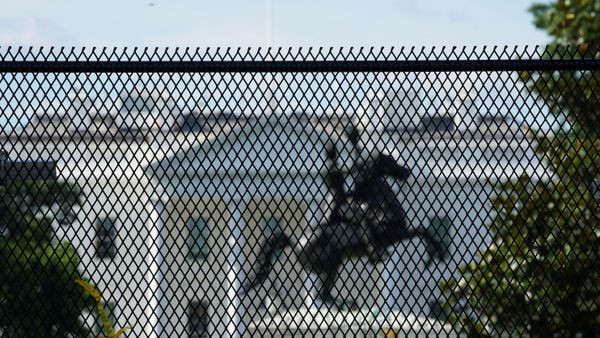 The White House and the statue of President Andrew Jackson are seen behind a  high fence reinforcing a security perimeter after racial inequality protesters attempted to tear down the statue earlier this week, in Washington, D.C., U.S., June 24, 2020.  REUTERS/Kevin Lamarque    - Sputnik International