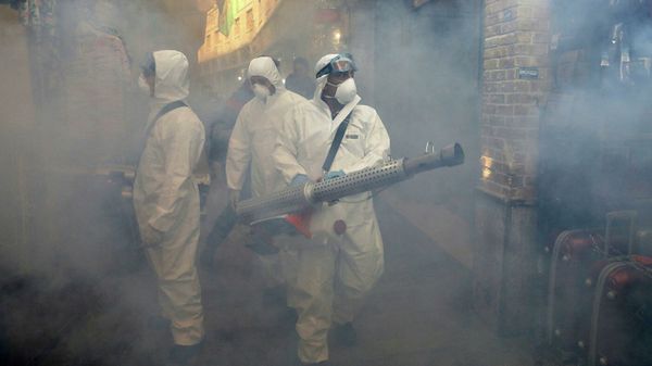 Firefighters spray a disinfectant in Tehran - Sputnik International