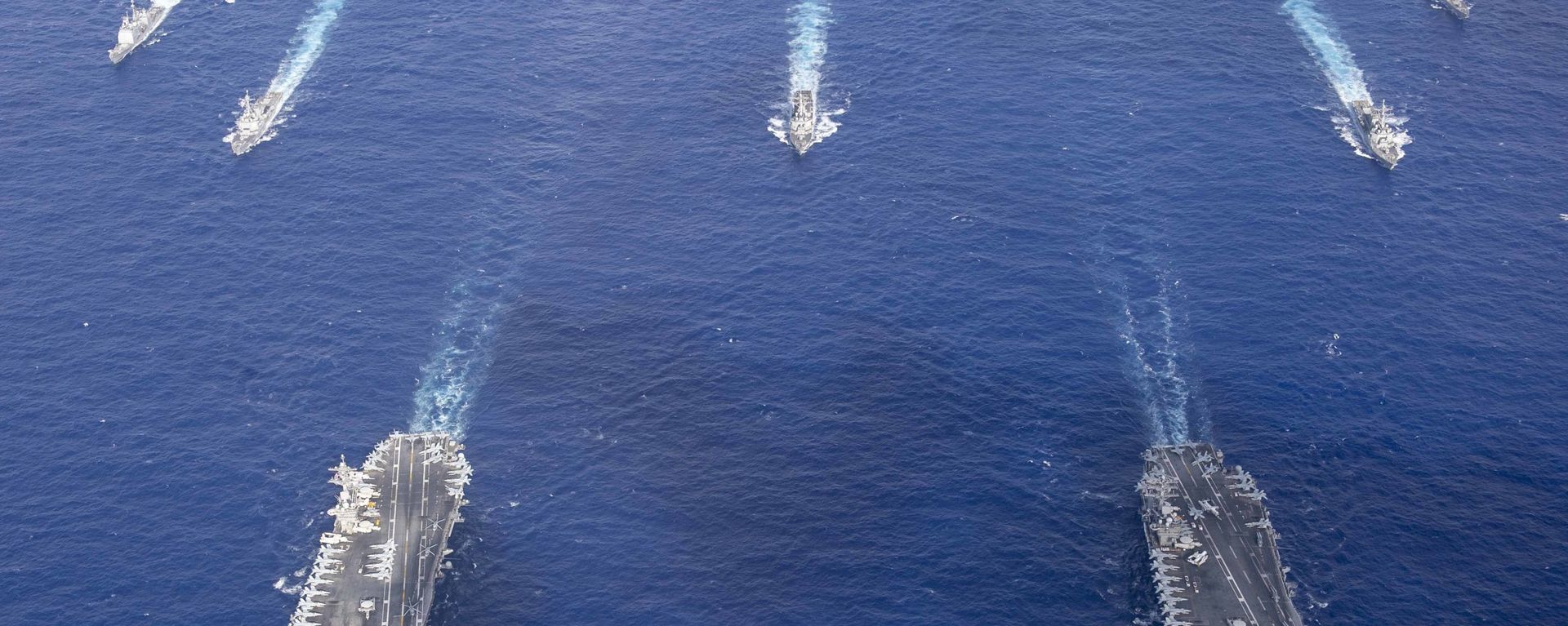 The Theodore Roosevelt Carrier Strike Group transits in formation with the Nimitz Carrier Strike Group while conducting dual carrier and airwing operations in the Philippine Sea June 23, 2020. The Theodore Roosevelt Carrier Strike Group transits in formation with the Nimitz Carrier Strike Group while conducting dual carrier and airwing operations in the Philippine Sea June 23, 2020. - Sputnik International, 1920, 17.09.2021