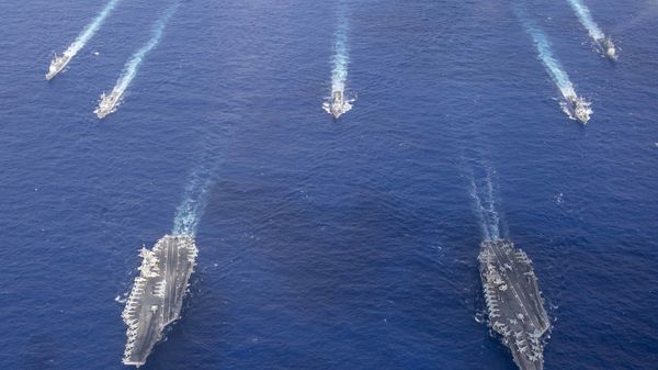 The Theodore Roosevelt Carrier Strike Group transits in formation with the Nimitz Carrier Strike Group while conducting dual carrier and airwing operations in the Philippine Sea June 23, 2020. The Theodore Roosevelt Carrier Strike Group transits in formation with the Nimitz Carrier Strike Group while conducting dual carrier and airwing operations in the Philippine Sea June 23, 2020. - Sputnik International