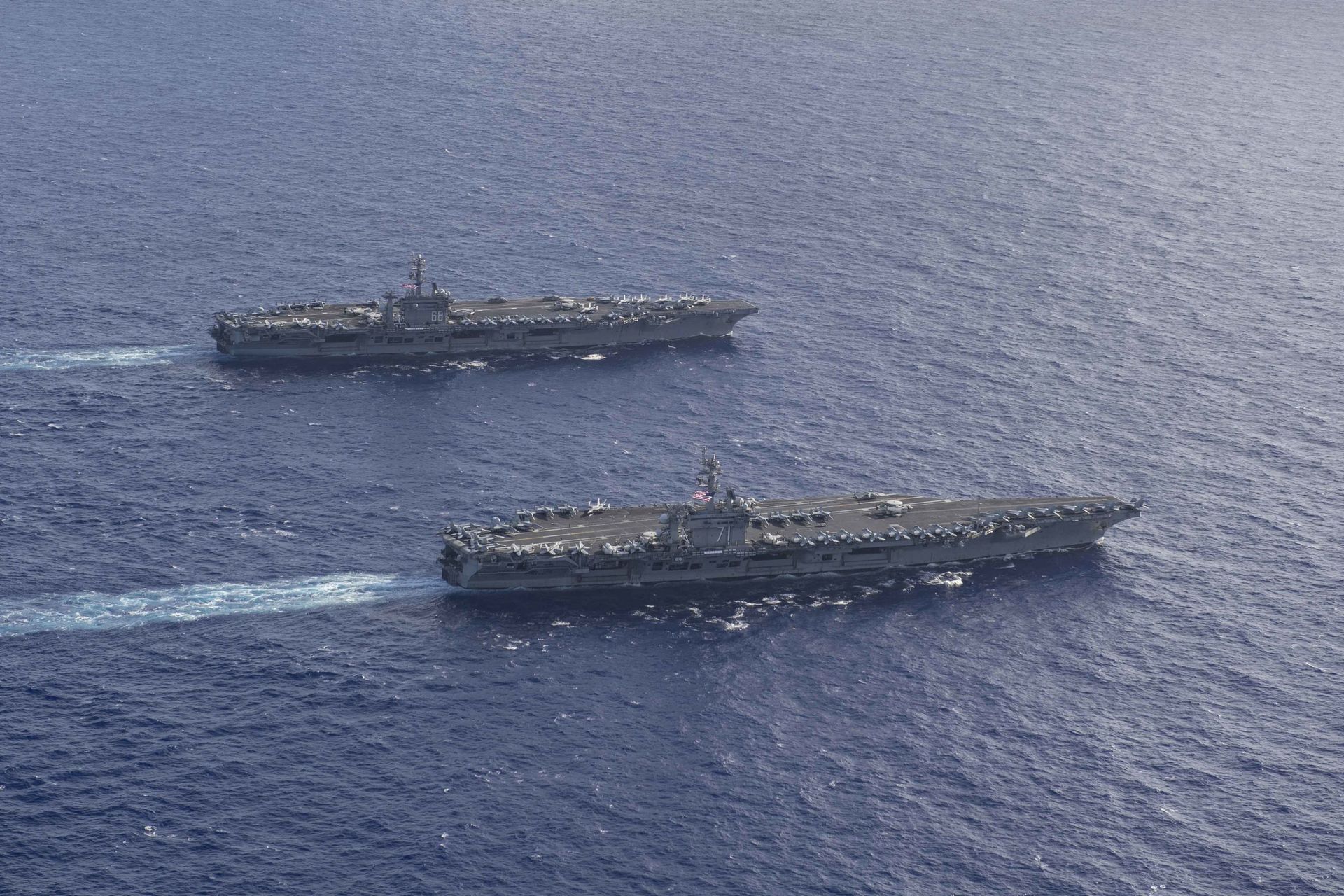 The Theodore Roosevelt Carrier Strike Group transits in formation with the Nimitz Carrier Strike Group while conducting dual carrier and airwing operations in the Philippine Sea June 23, 2020. The Theodore Roosevelt Carrier Strike Group transits in formation with the Nimitz Carrier Strike Group while conducting dual carrier and airwing operations in the Philippine Sea June 23, 2020. - Sputnik International, 1920, 19.12.2022