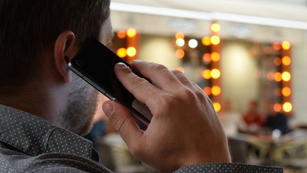 Man with phone - Sputnik International